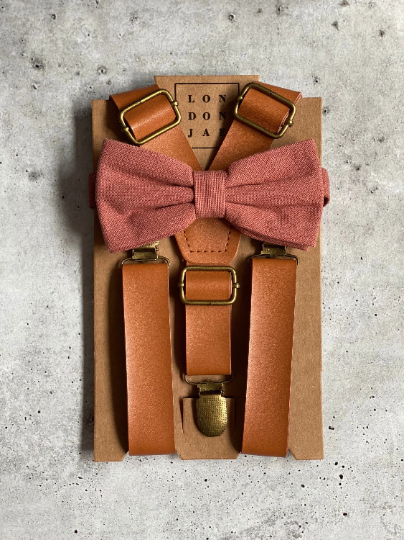 This adjustable Caramel Leather Suspenders with Sedona Cotton Bow Tie Set is perfect for your groomsmen, ring bearers, family photos or just because! Suspenders come with brass clips unless silver clips are requested.